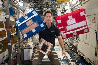 Thomas Pesquet with medical bags on ISS