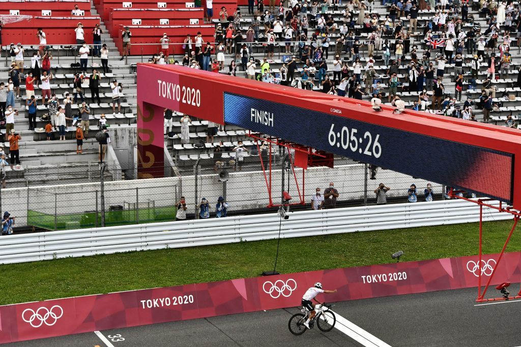 Ecuadors Richard Carapaz celebrates as he crosses the finish line to win the mens cycling road race during the Tokyo 2020 Olympic Games at the Fuji International Speedway in Oyama Japan on July 24 2021 Photo by Jeff PACHOUD AFP Photo by JEFF PACHOUDAFP via Getty Images