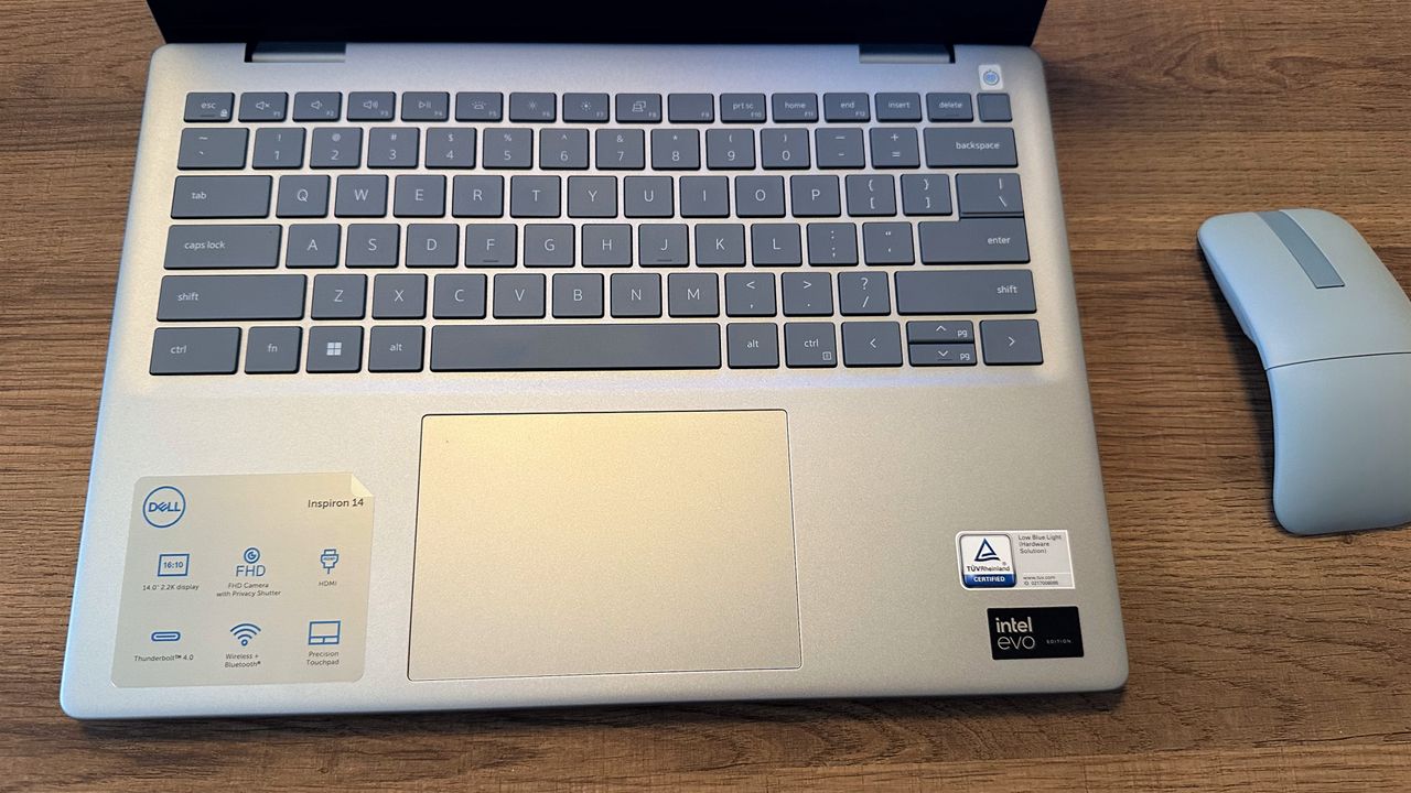Dell Inspiron 14 Plus (7440) open showing the keyboard and touchpad.