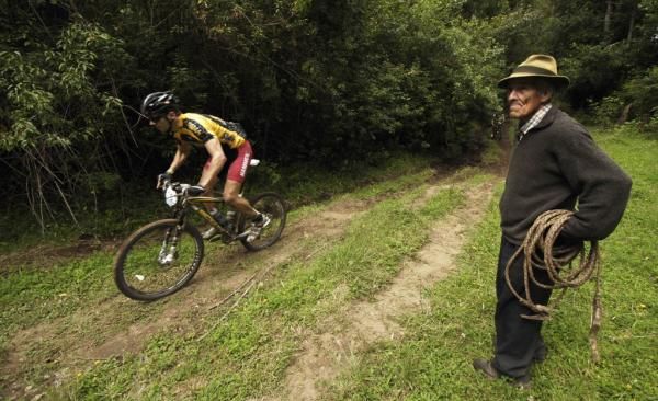 A lone racer passes a spectator en route