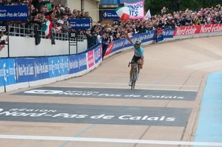 Tom Boonen takes the applause as he rides his first lap of the Roubaix velodrome
