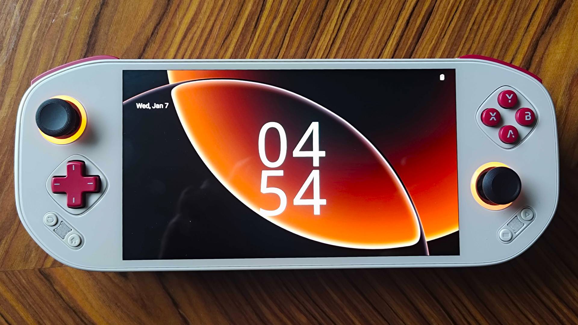 Front view of Mangmi Pocket Max with clock lock screen displayed.