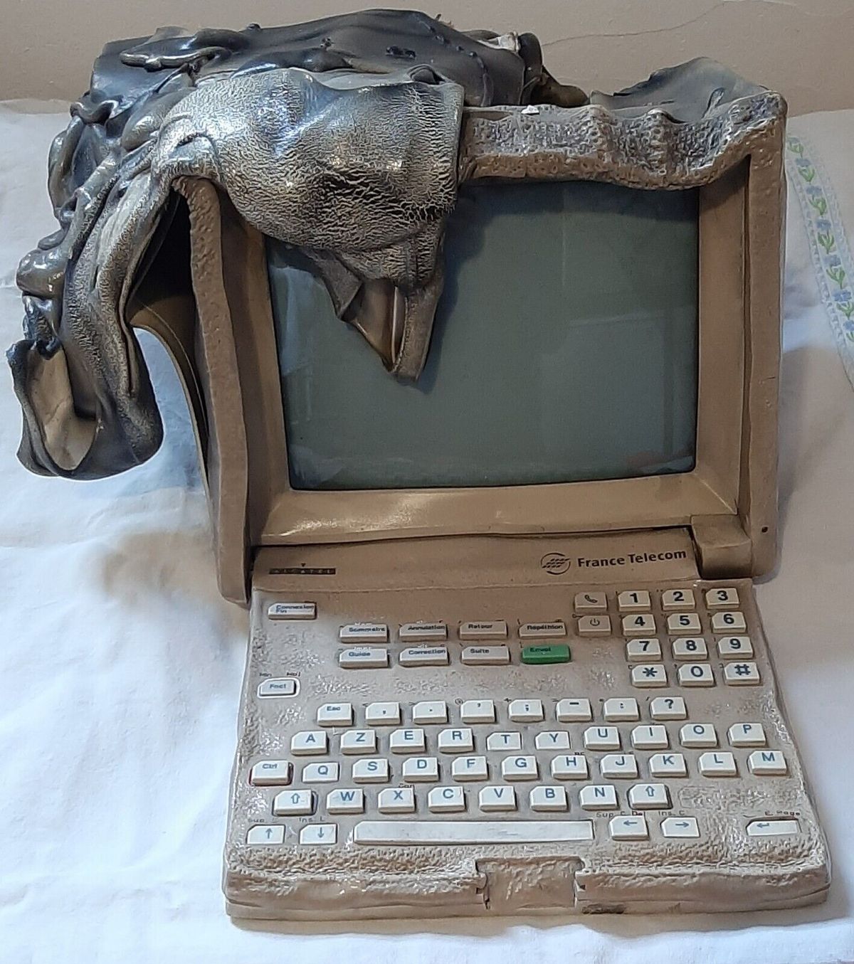 Front view of melted Alcatel initel 2