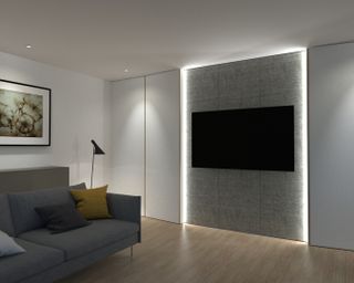 Modern TV room with a wall mounted on the wall with a fabric panel behind