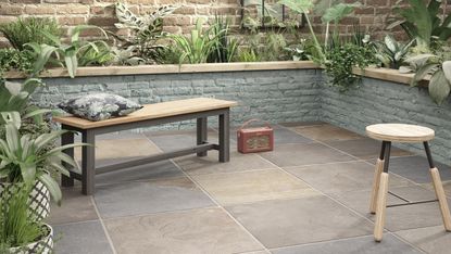 how to lay porcelain tiles outside: patio area with bench