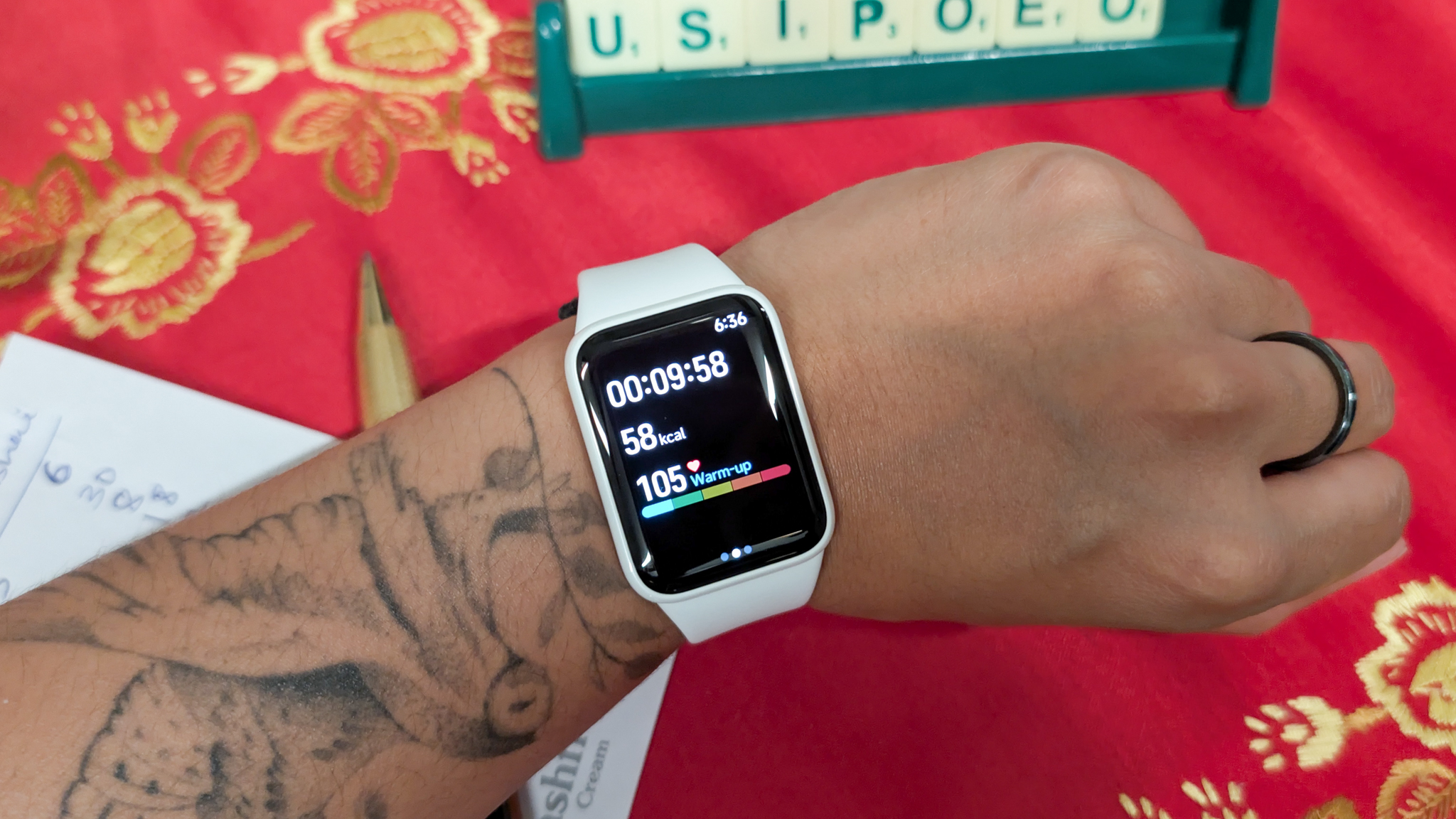 A person wearing a Xiaomi Smart Band 10 Pro smartwatch