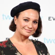 Gizzi Erskine with black dress and cap