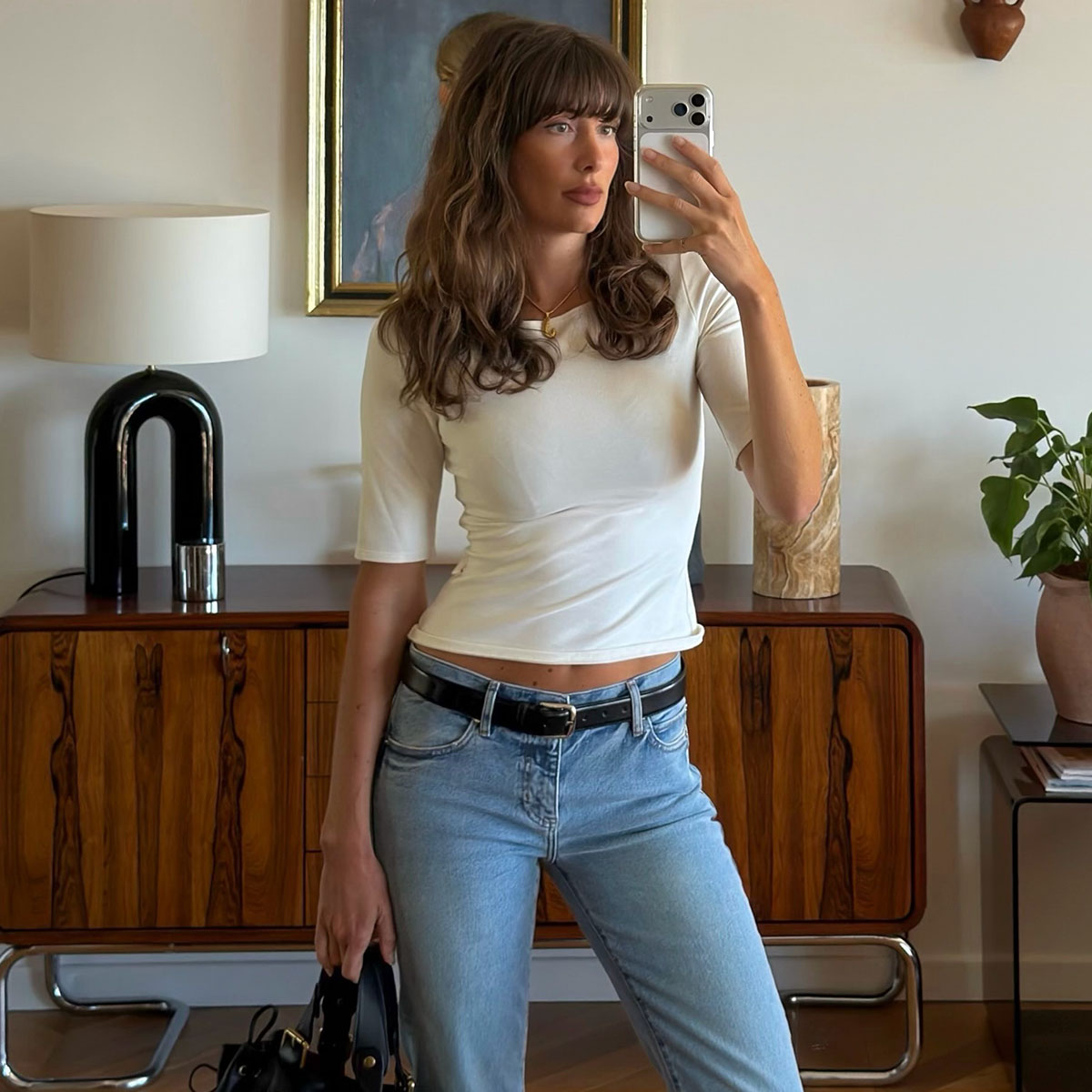 Woman in a white top and jeans