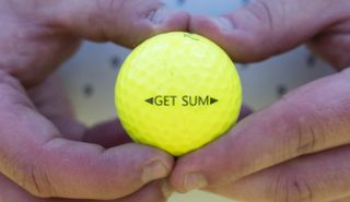 The Snell Get Sum Golf Ball, Get Sum is written down the side of the golf ball
