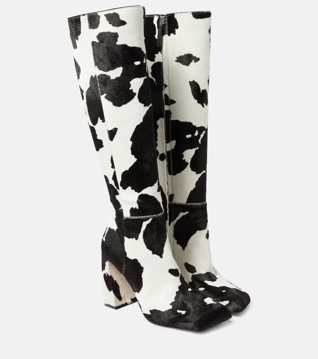 Cow print knee high boots