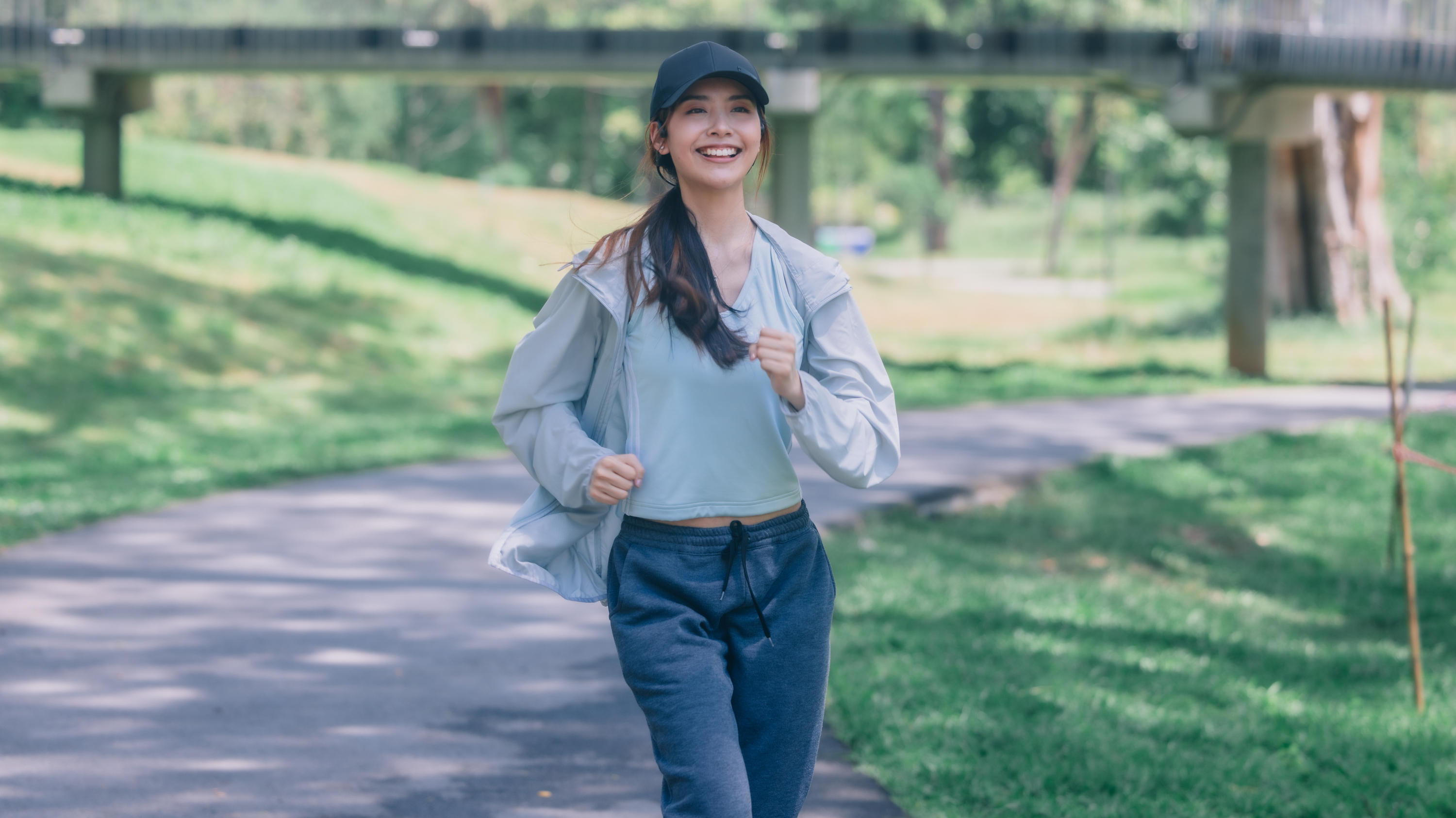 a woman running with a smile on her face