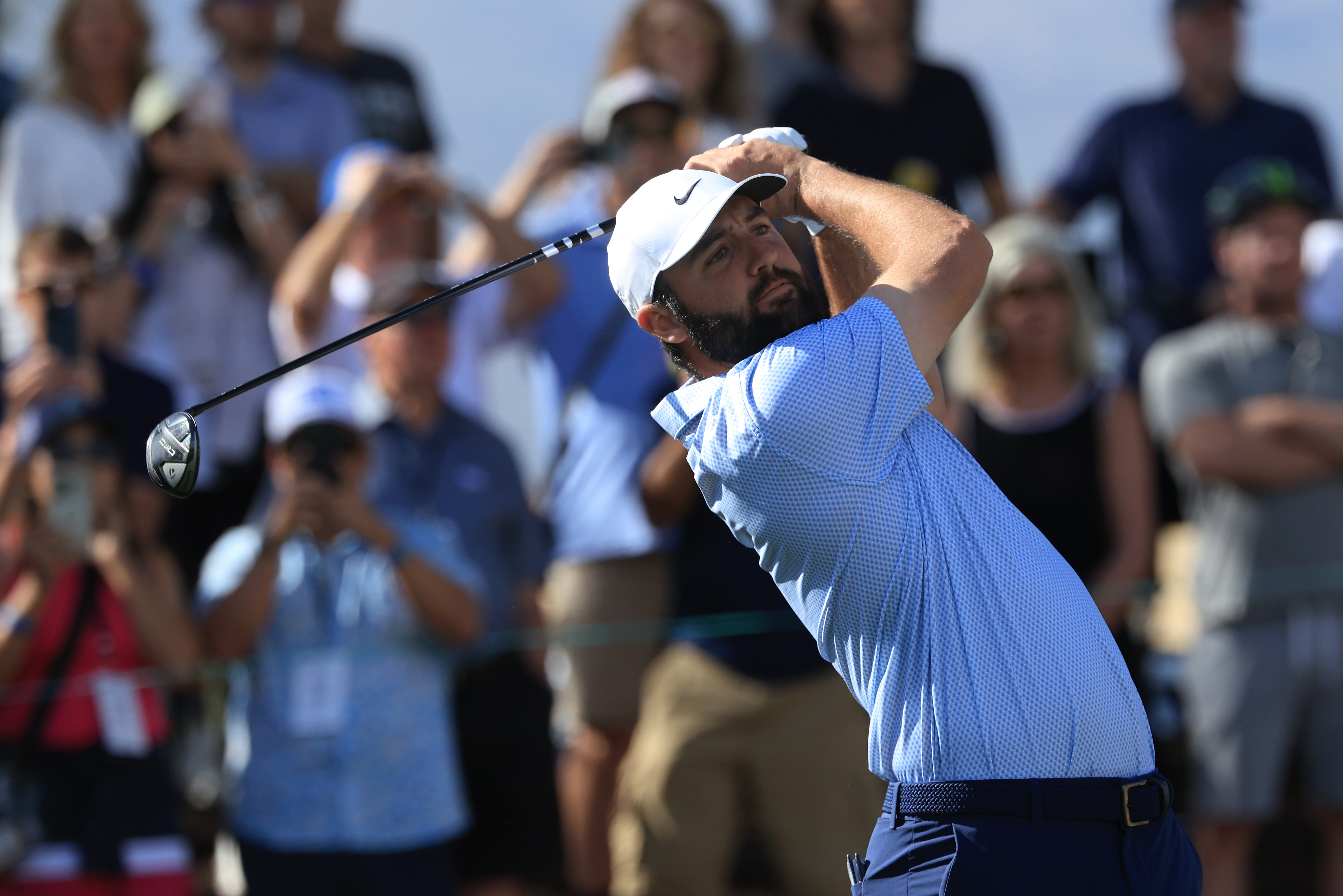 Scottie Scheffler hits a fairway wood off the tee