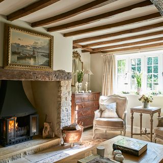 cottage with wood beams and wood burner