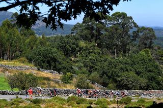 MOS SPAIN SEPTEMBER 04 A general view of Lilian Calmejane of France Clment Champoussin of France Stan Dewulf of Belgium and AG2R Citren Team Floris De Tier of Belgium and Team AlpecinFenix Daniel Navarro Garcia of Spain and Team Burgos BH Jess Herrada Lopez of Spain and Team Cofidis Mikel Bizkarra Etxegibel of Spain and Team Euskaltel Euskadi Jan Hirt of Czech Republic and Team Intermarch Wanty Gobert Matriaux Sylvain Moniquet of Belgium and Team Lotto Soudal Nicholas Schultz of Australia and Team BikeExchange Chris Hamilton of Australia and Team DSM Romain Bardet of France and Team DSM Michael Storer of Australia and Team DSM polka dot mountain jersey Matteo Trentin of Italy and UAE Team Emirates Ryan Gibbons of South Africa and UAE Team Emirates compete in the breakaway passing through Loureza during the 76th Tour of Spain 2021 Stage 20 a 2022km km stage from Sanxenxo to Mos Alto Castro de Herville 502m lavuelta LaVuelta21 on September 04 2021 in Mos Spain Photo by Tim de WaeleGetty Images
