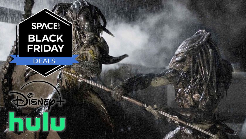 Two alien-like creatures are mid battle, holding a staff while rain pours and steam appears in the background.