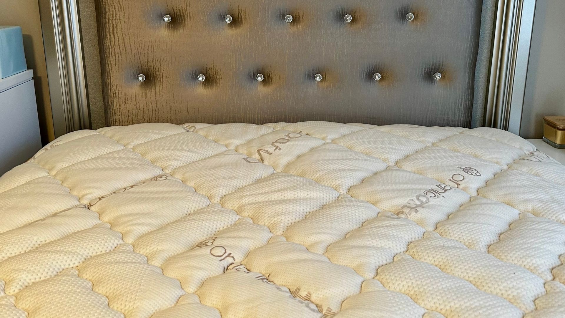 The image shows the Saatva Solaire Adjustable Firmness Mattress set up in our tester&#039;s home