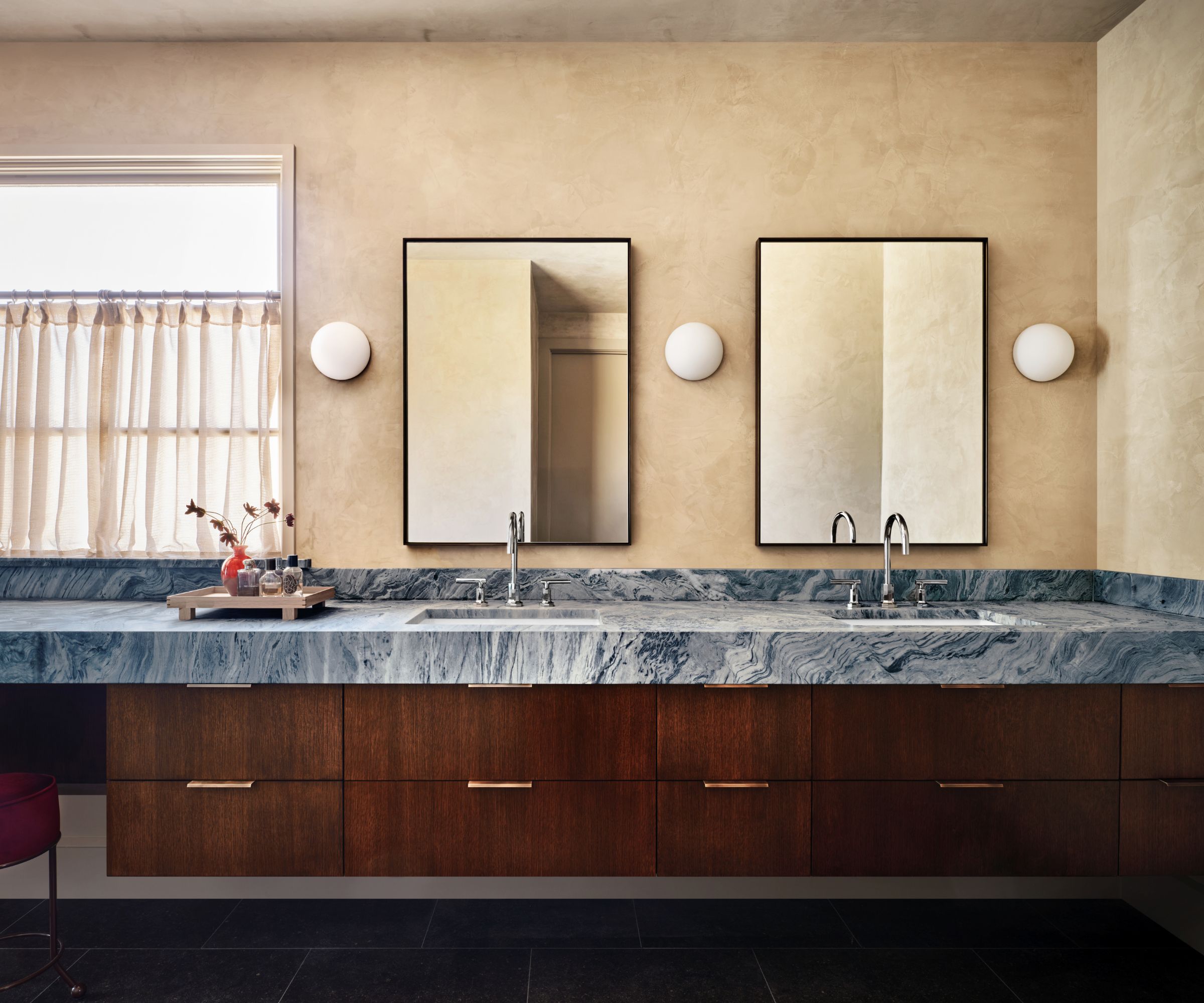 Modern bathroom with plaster walls, countertop with blue marble and wood and mr and mrs sinks