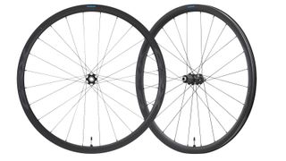 A pair of Shimano GRX wheels on a white background
