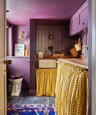 Emilie Fornet Interiors purple boot room with yellow sink curtain, photograph Kasia Fiszer