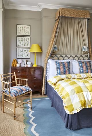 Yellow check quilt on a bed in a traditional bedroom
