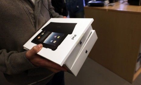 Customers wait in line to buy the iPad 2 last month: Apple seems to be untouchable in the tablet market, but some say the company can&amp;#039;t stay on top forever.