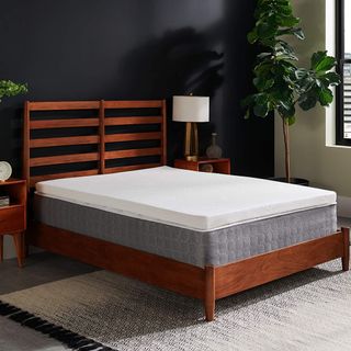 Best mattress topper on wooden bed frame on mattress