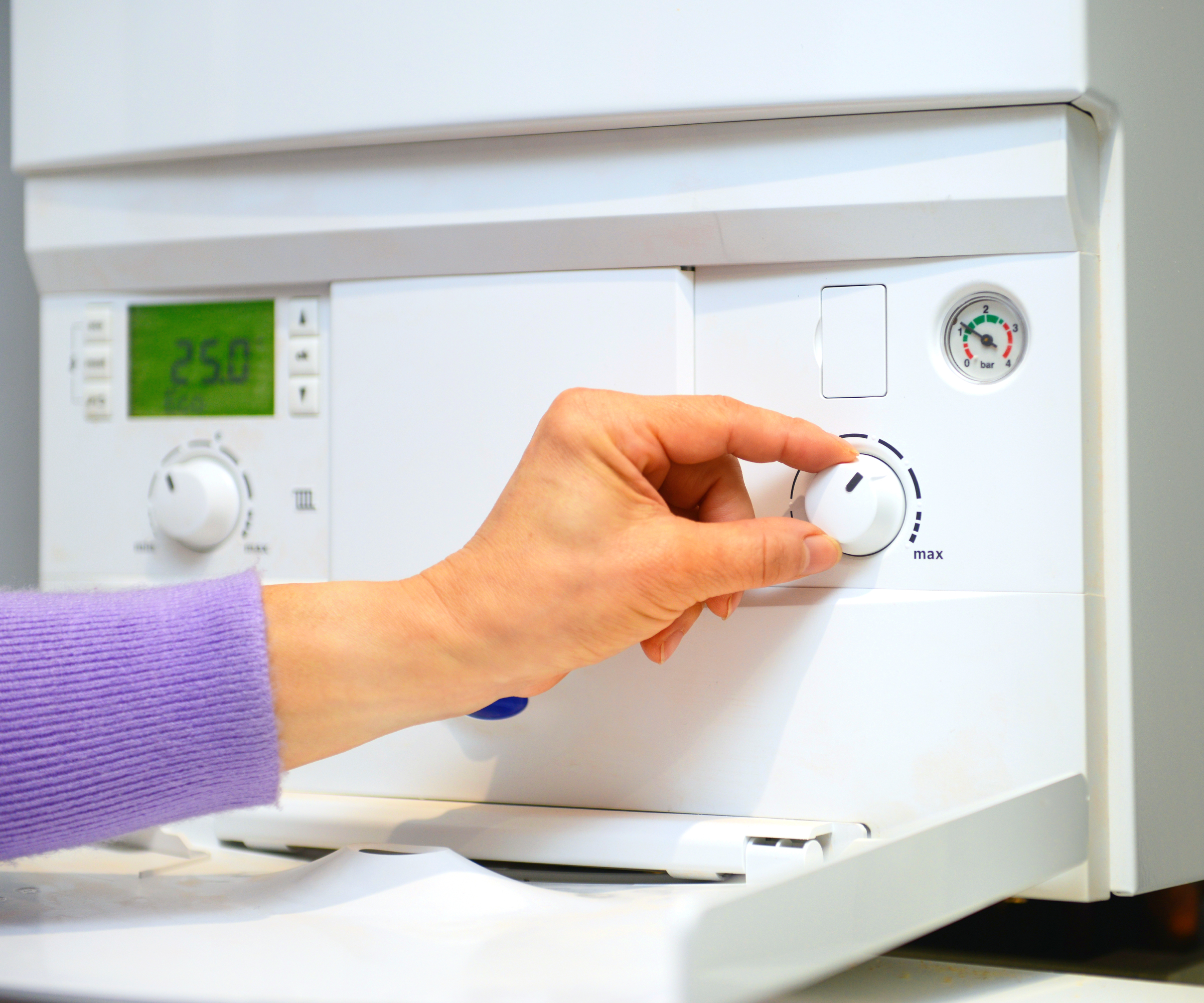 hand adjusting dial on boiler