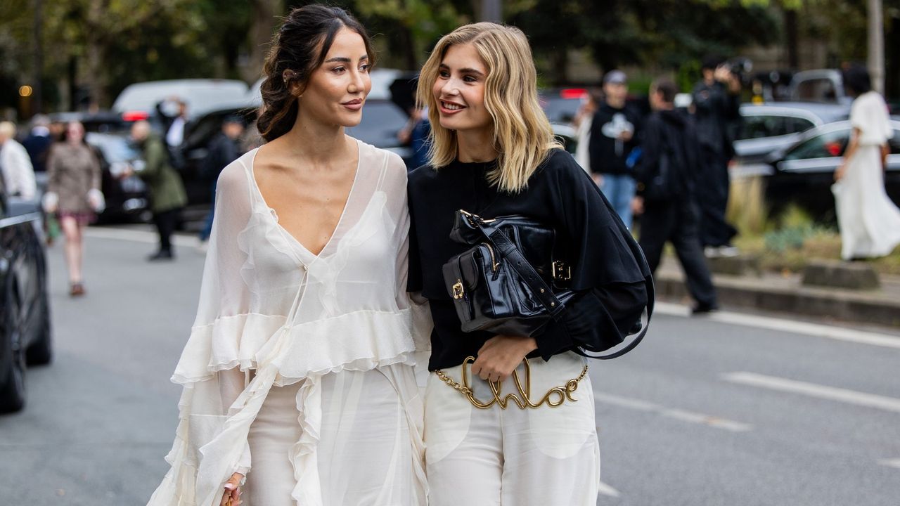 Two guests at the Chloé show in Paris, wearing head-to-toe looks and Chloé perfume