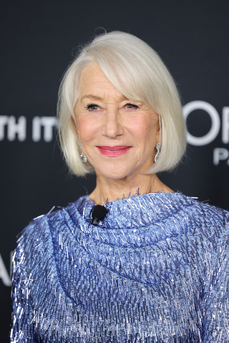 Helen Mirren is pictured with a sleek bob hairstyle and wearing a blue dress at the 20th Anniversary of L'Or&amp;eacute;al Paris Women of Worth at Academy Museum of Motion Pictures on December 02, 2025 in Los Angeles, California.