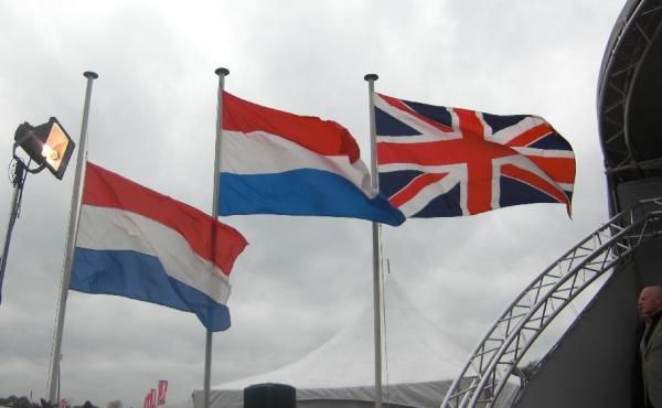 The British flag flies alongside the two Dutch flags during the women's podium presentation.