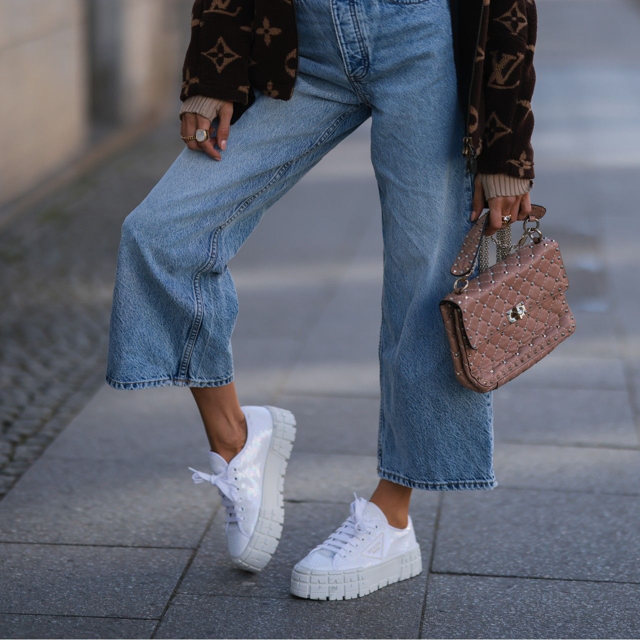 woman wearing chunky 90s style sneakers