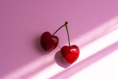 Gynaecological cancer: Close-up of cherry on pink background