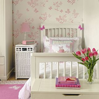 childrens room with butterfly wallpaper