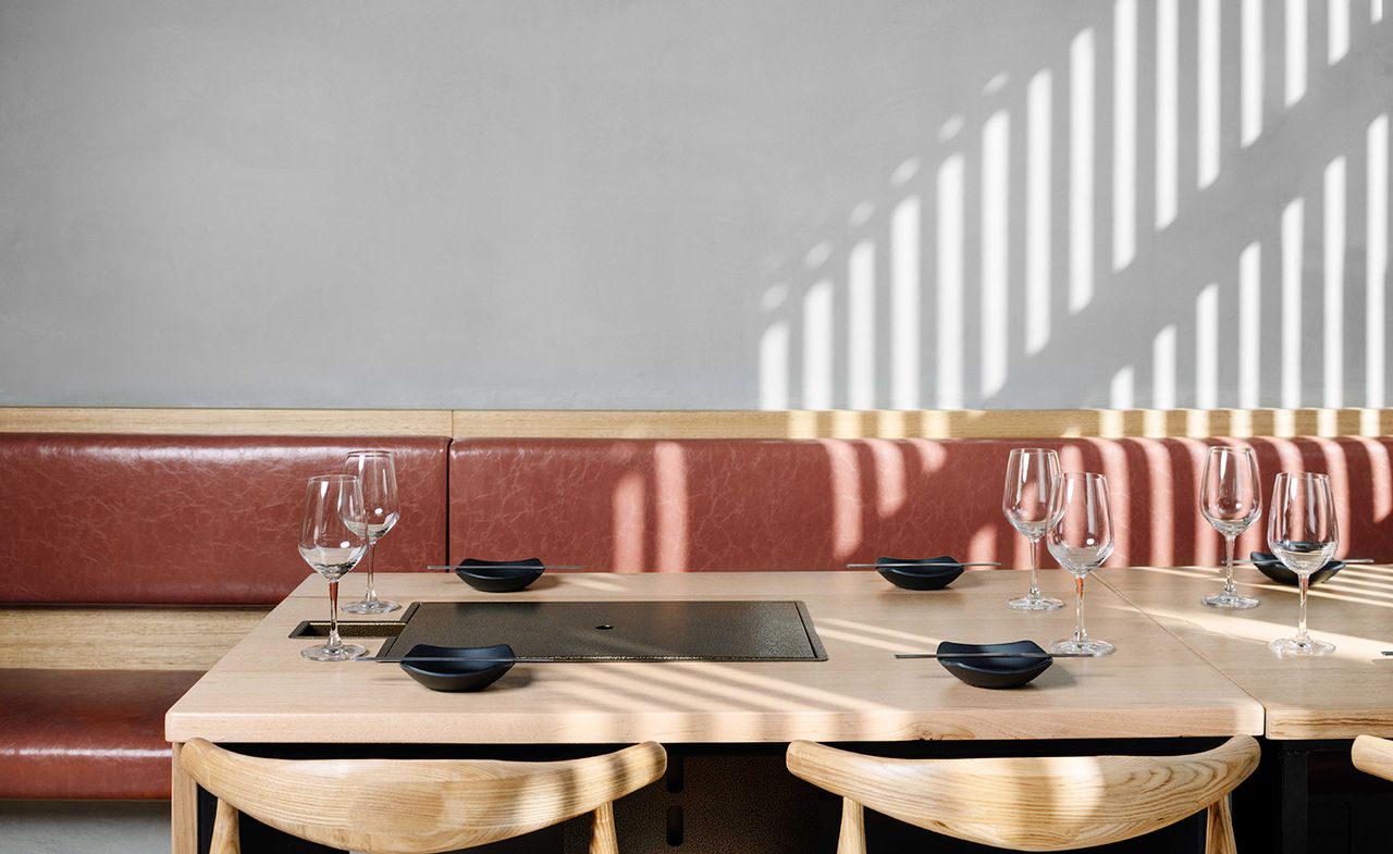 An image of restaurant with bowls and wine glasses