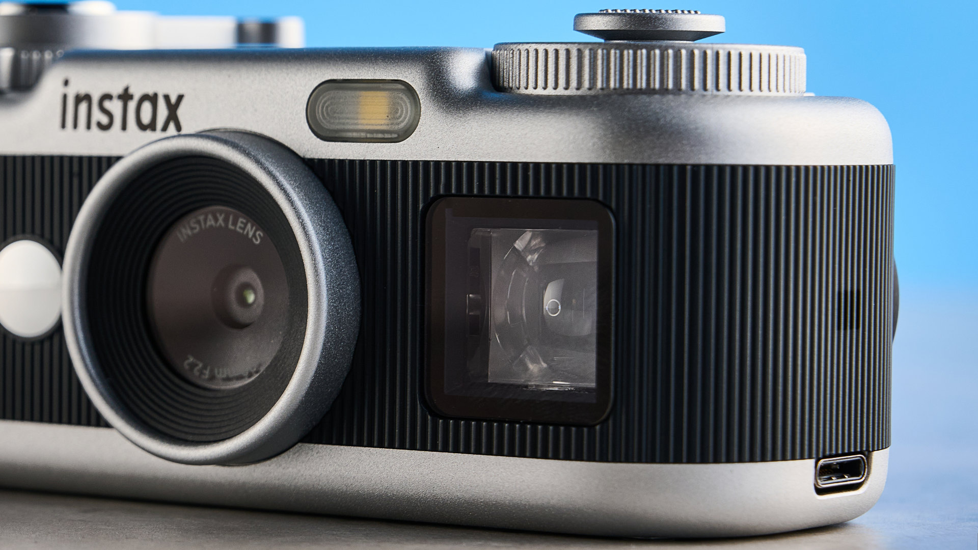A black and silver Fujifilm Instax Pal 2 digital camera
