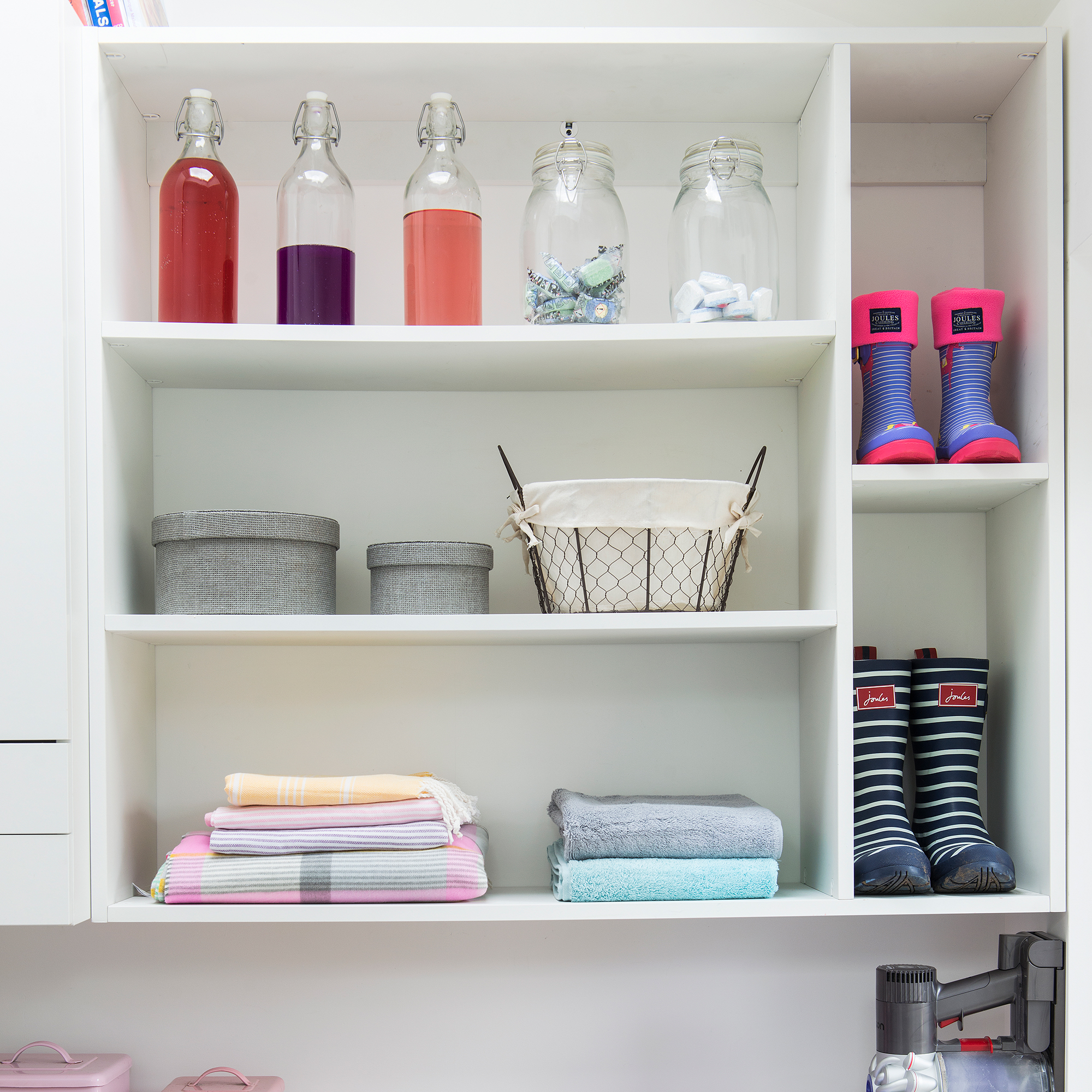 White open shelving storage in utility room