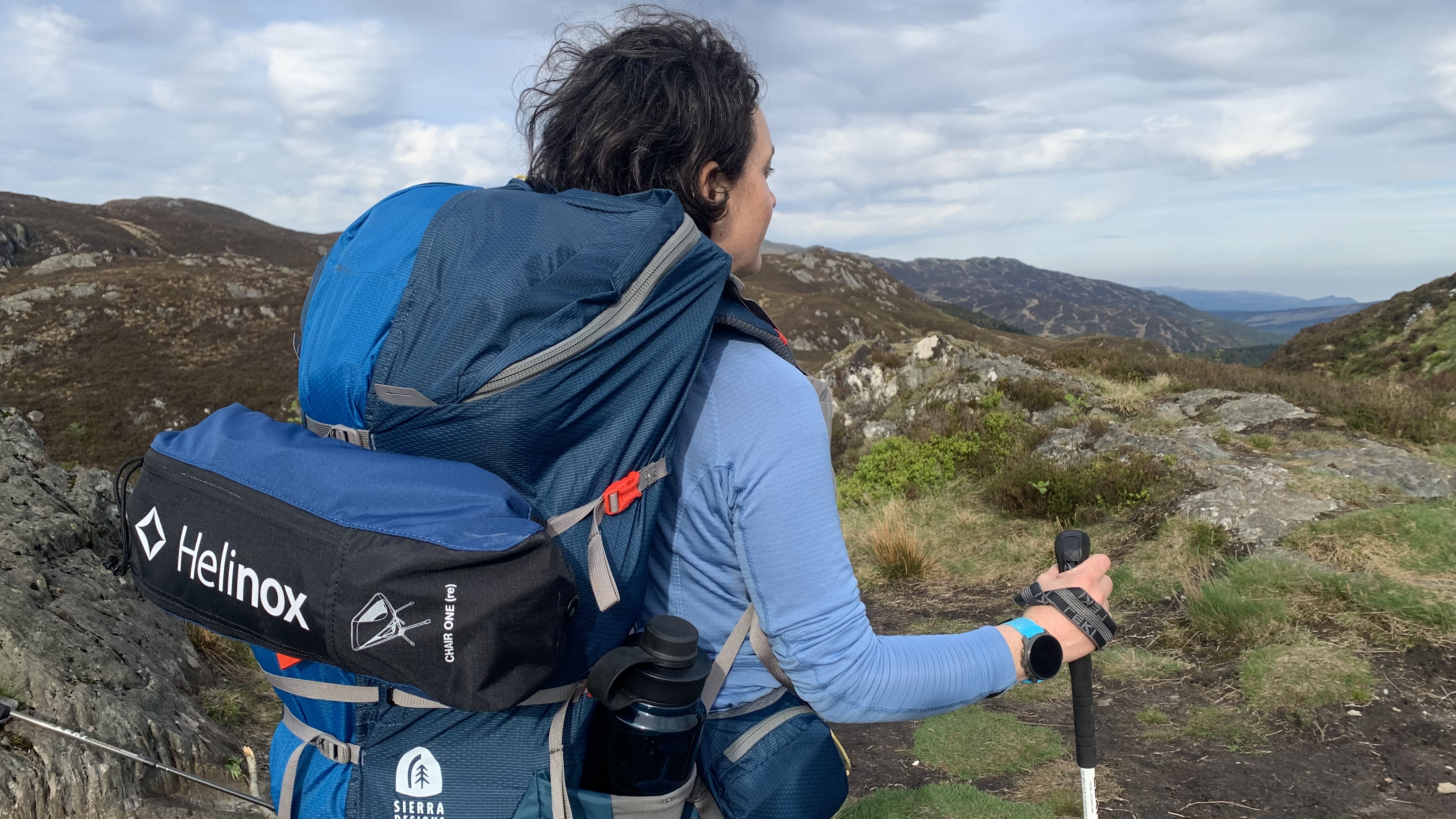 Julia Clarke backpacking with the Helinox Chair One (Re) strapped to her pack