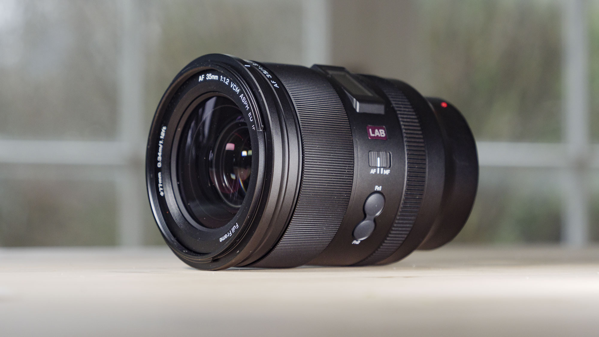 Viltrox AF 35mm F1.2 LAB Z lens for Nikon, on a wooden table