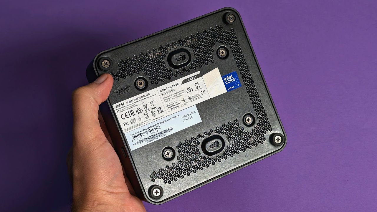 MSI Cubi NUC AI+ 2MG mini PC on a purple card stock background