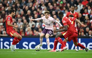 Brentford squad for 2024/25 LIVERPOOL, ENGLAND - AUGUST 25: Keane Lewis-Potter of Brentford runs with the ball under pressure from Dominik Szoboszlai, Alexis Mac Allister and Ibrahima Konate of Liverpool during the Premier League match between Liverpool FC and Brentford FC at Anfield on August 25, 2024 in Liverpool, England. (Photo by Michael Regan/Getty Images)