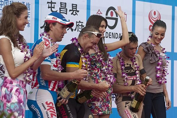 Miss World entrants watch on as the placegetters from stage one battle with the bottles of champers.