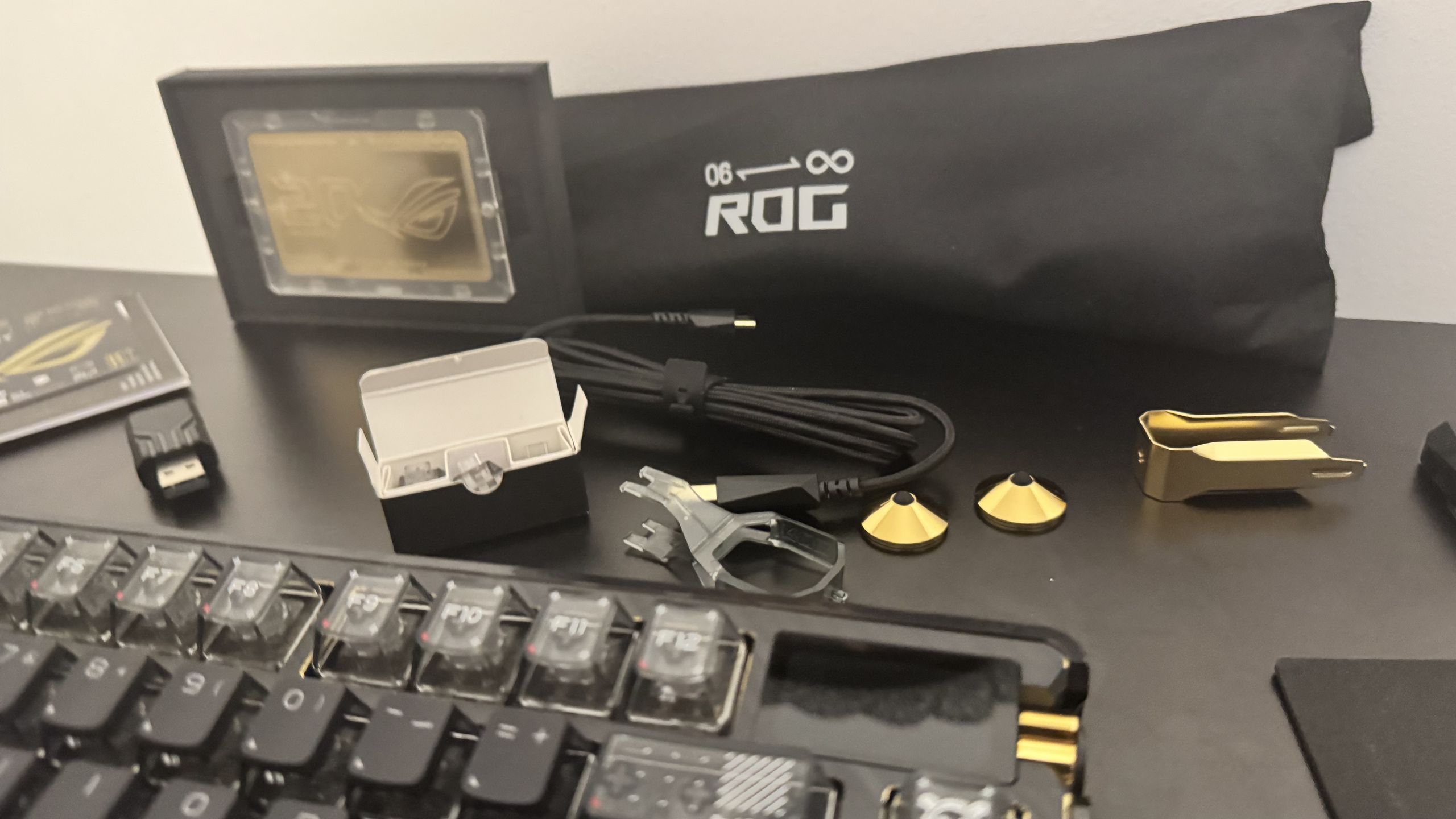 Asus ROG Azoth Extreme Edition 20 extra accessories on a table