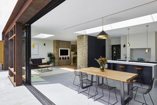 modern kitchen diner extension with rooflights and polished concrete flooring