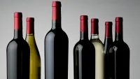bottles of red wine on a gray background