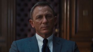 James Bond listening to M vent about his latest adversary Lyutsifer Safin's technology-based plan in the trailer for No Time to Die