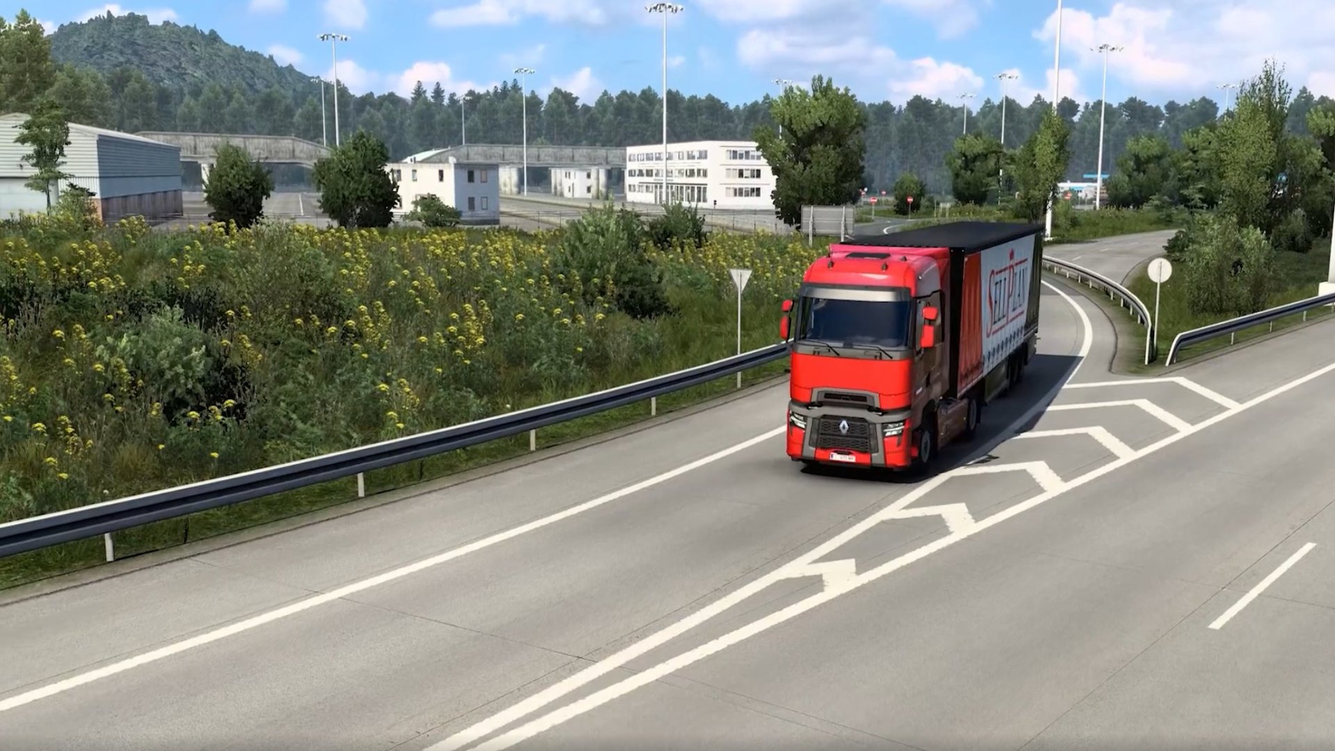 Euro Truck Simulator 2 screenshot of a red truck driving down a road
