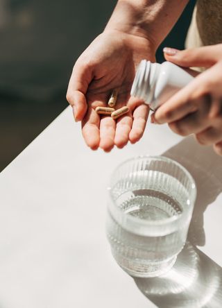 Woman taking supplements