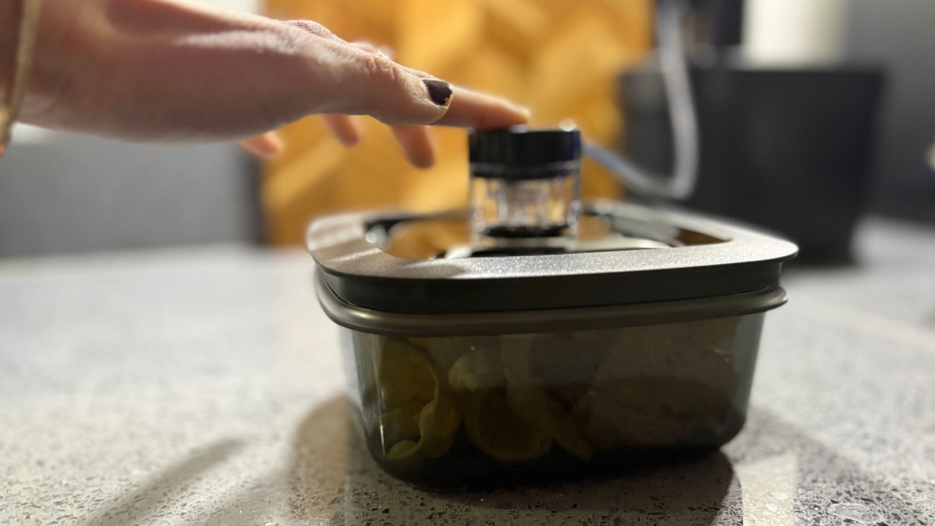 BORA QVac sealing a container of soup