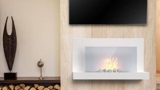 picture of TV above Fireplace in living room