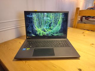 An Acer Aspire 7 sitting on a wooden desk